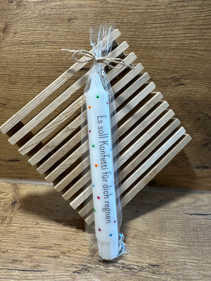 in geschenkfolie verpackt stabkerze geburtstag konfetti